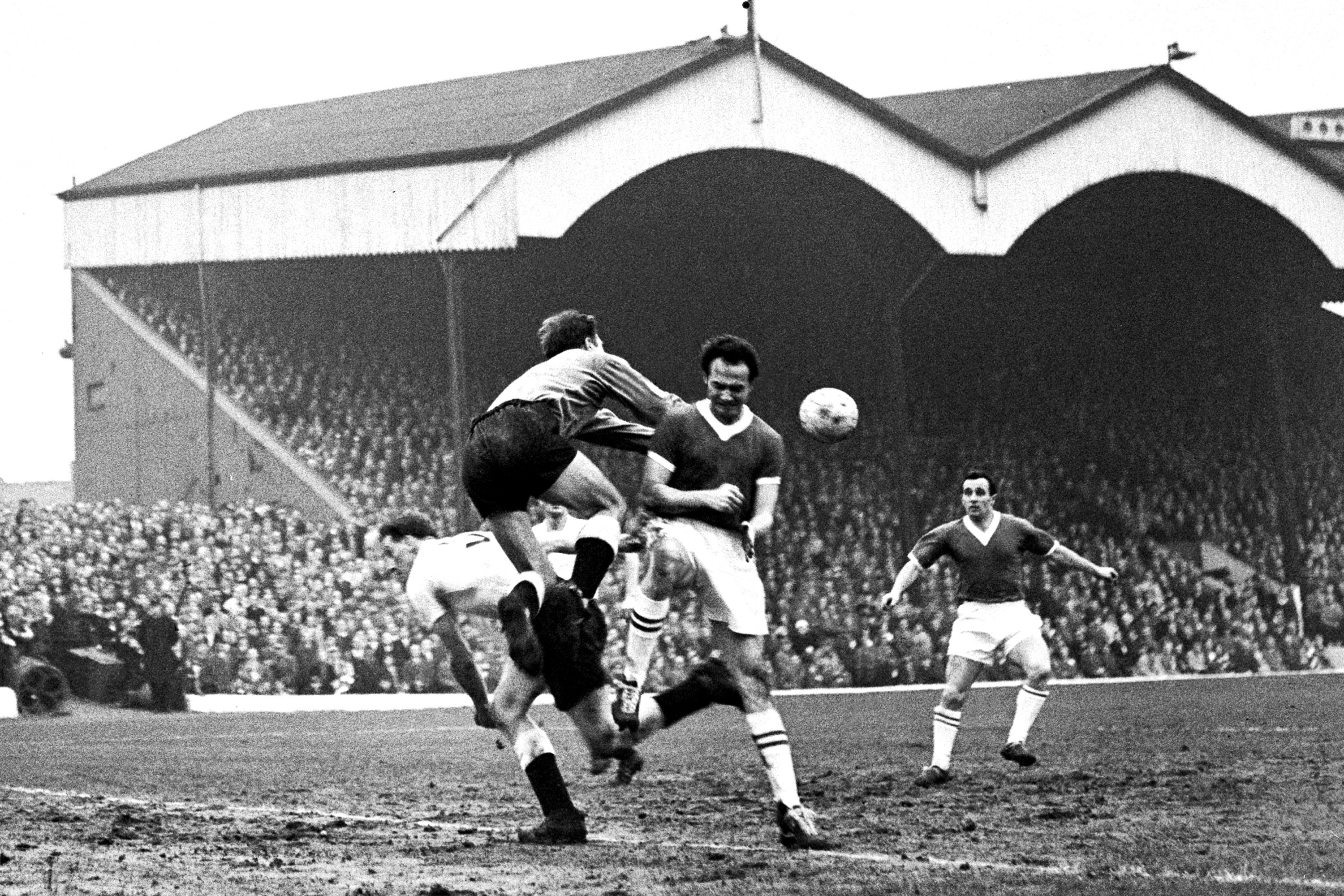 Derby County goalkeeper Reg Matthews punches clear from Charlton's Stuart Leary