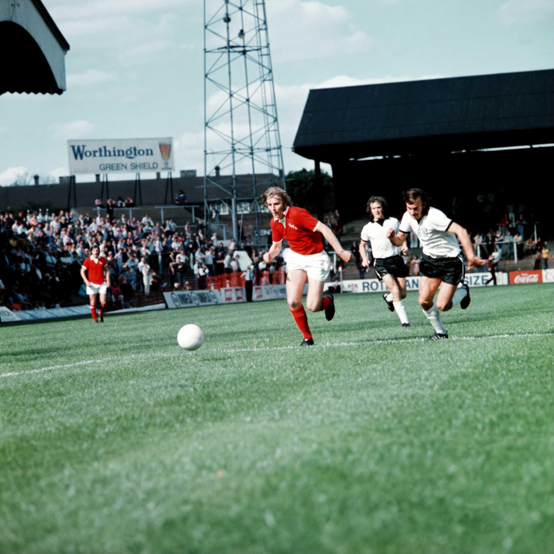 Colin Powell gets away from Hereford United's Tony Byrne