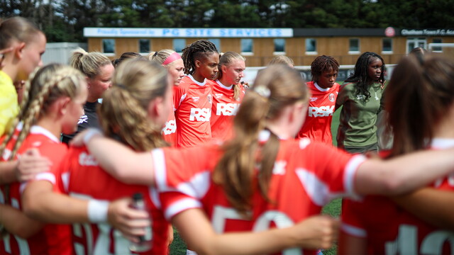 Players huddle at Chatham Town