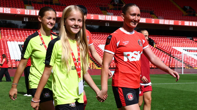 Mascot walking out with Keira Flannery