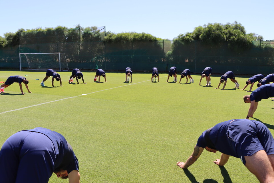 The Addicks squad stretch ahead of training
