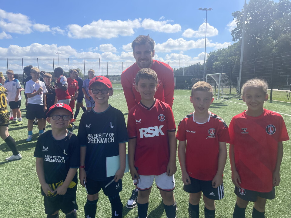 Scott Fraser posing with five Charlton fans