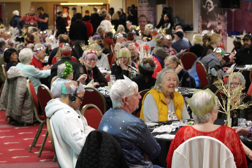 Extra Time members sat at the tables talking