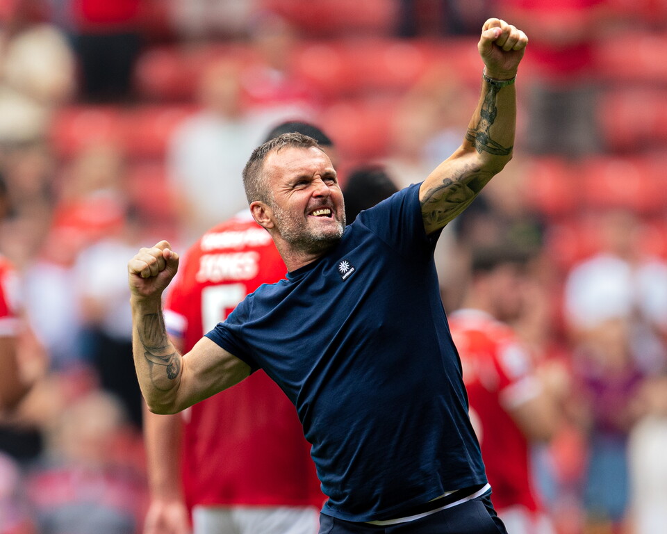 Nathan Jones celebrates with the Valley faithful