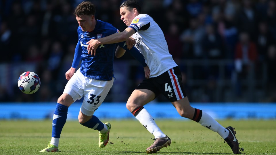 Dobson battles for the ball