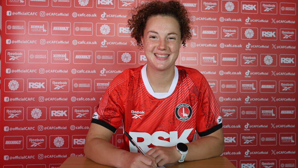 Mary signing
