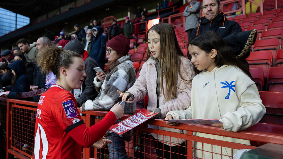 Mary McAteer after the WSL 2 match at The Valley signing autographs